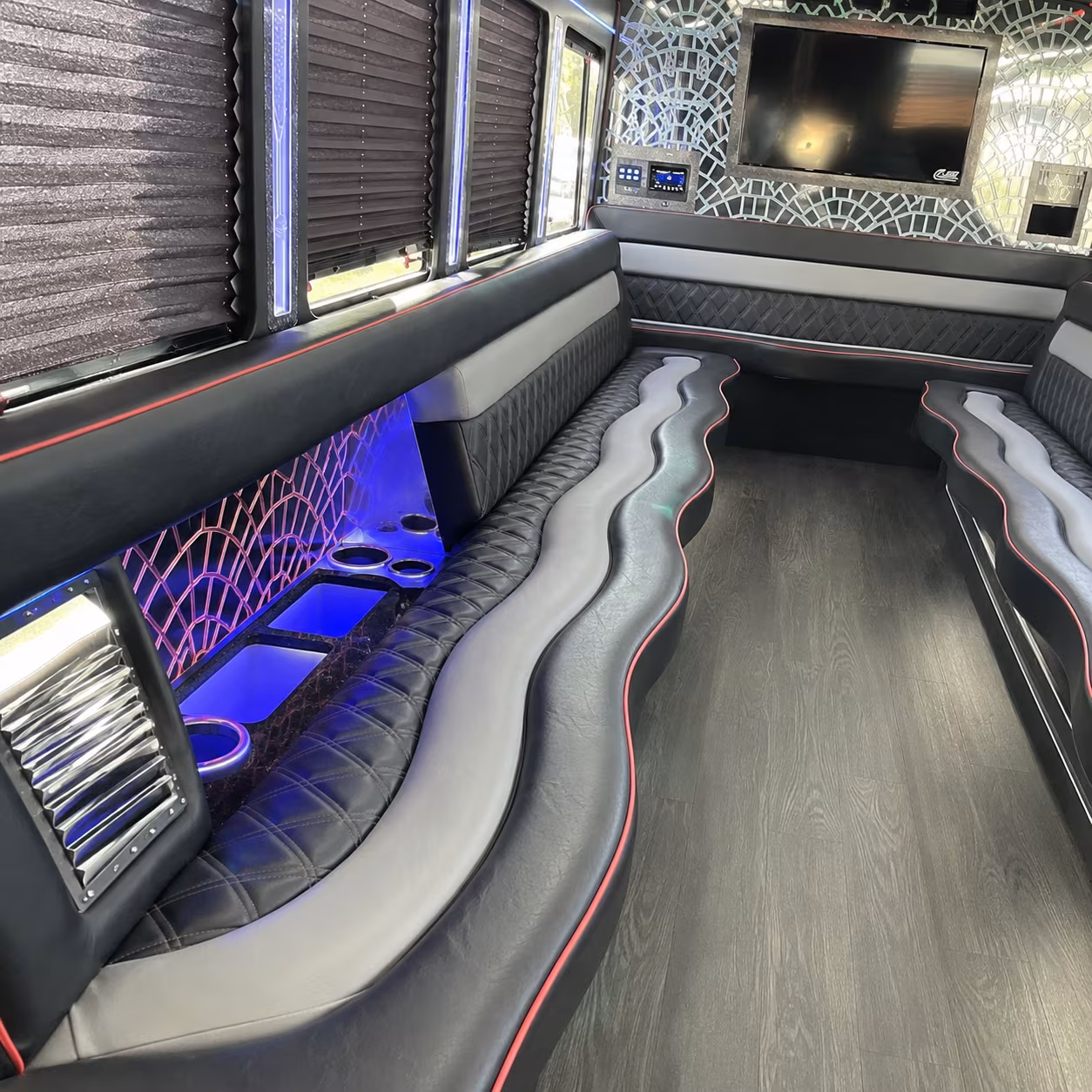 Friends laughing during a party bus celebration in Jacksonville